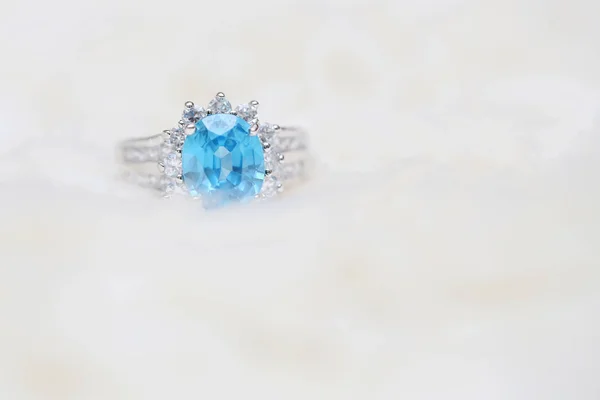 diamond ring and blue gemstone