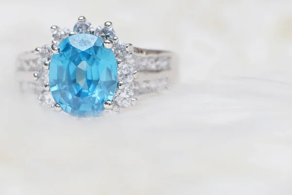 diamond ring and blue gemstone