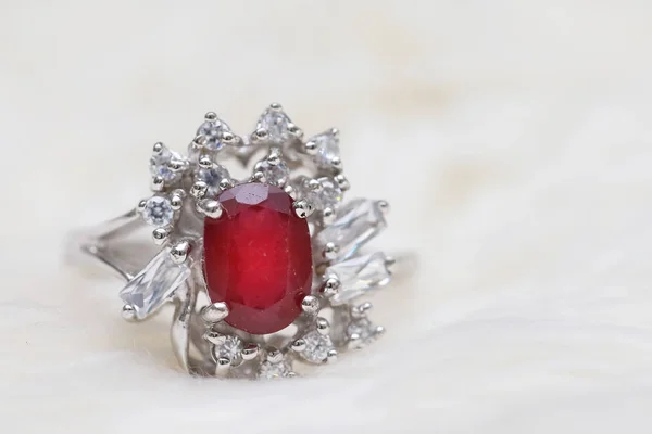 Red gemstone on diamond ring — Stock Photo, Image