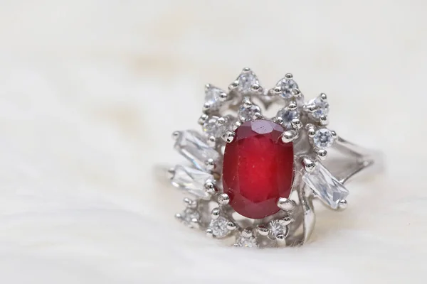 Red gemstone on diamond ring — Stock Photo, Image