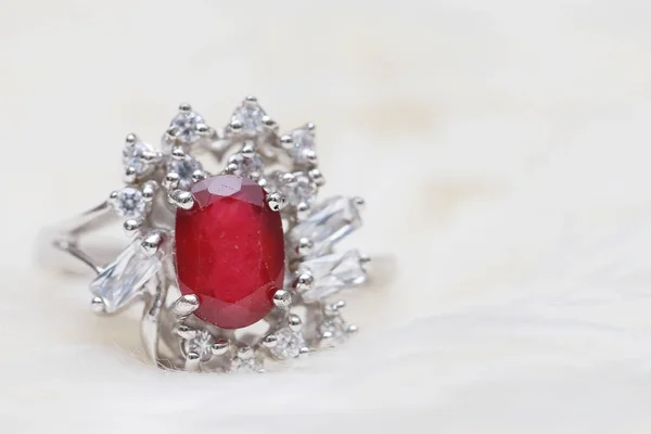 Red gemstone on diamond ring — Stock Photo, Image