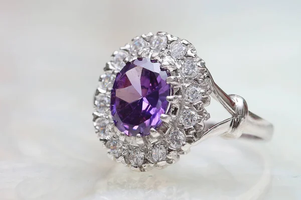 Diamond ring and purple gemstone — 스톡 사진