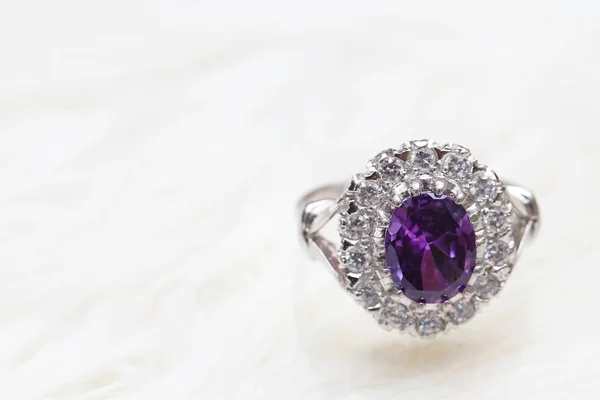 Purple gemstone on diamond ring — Stock Photo, Image