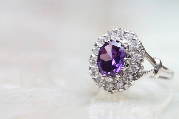 Purple gemstone on diamond ring — 스톡 사진