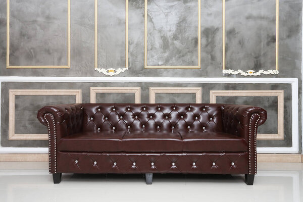 brown leather sofa in the room