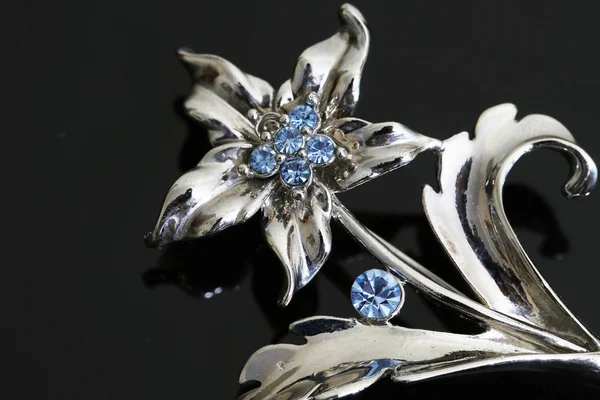 Brooch with silver flowers and jewellry — 스톡 사진