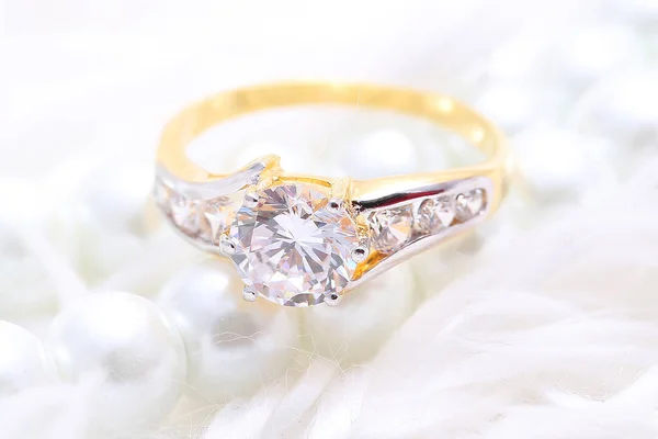 Golden ring with diamond and pearl — Stock Photo, Image