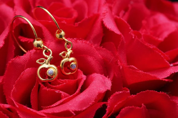 Ear-ring with flower and jewellery — Stock Photo, Image