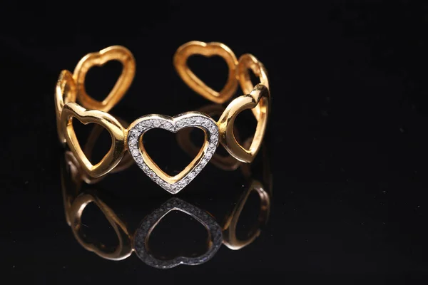 Gold bracelet with hearts — Stock Photo, Image