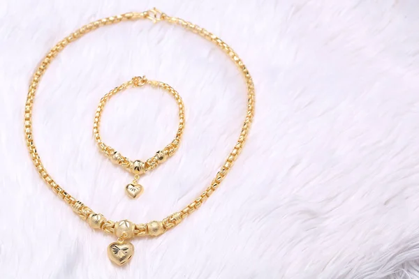 Golden heart pendant , Neck lace, Golden bracelet — Stock Photo, Image