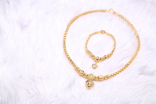 Golden heart pendant , Neck lace, Golden bracelet — Stock Photo, Image