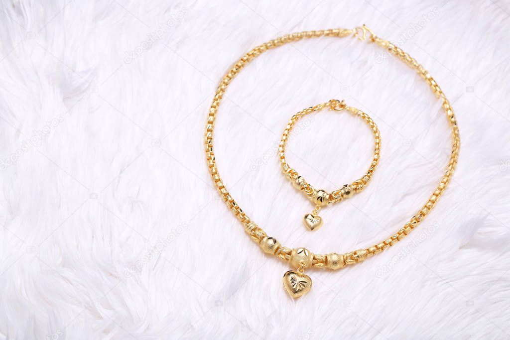Golden heart pendant , Neck lace, Golden bracelet