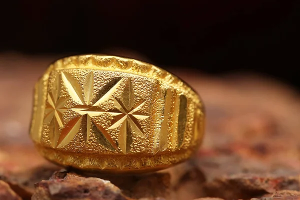 Old golden ring on stone texture — 스톡 사진