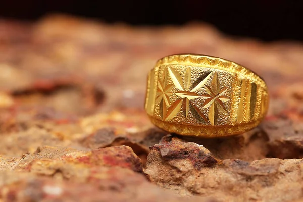 Old golden ring on stone texture — 스톡 사진