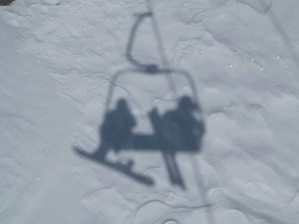 Shadows Snowboarder Skier Riding Chair Lift — Stock Photo, Image