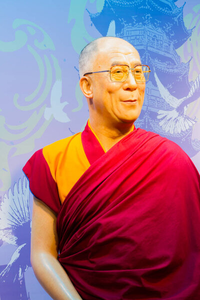 BANGKOK, THAILAND - DECEMBER 19: Wax figure of the famous Dalai Lama from Madame Tussauds on December 19, 2015 in Bangkok, Thailand.