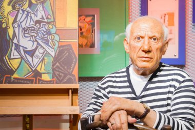 BANGKOK, THAILAND - DECEMBER 19: Wax figure of the famous Pablo Picasso from Madame Tussauds on December 19, 2015 in Bangkok, Thailand clipart