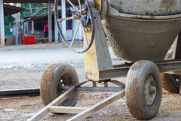 Closeup the wheels of cement mixer on the construction site, horizontal photo — Stock Photo, Image