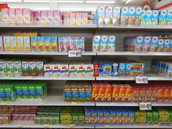 CHIANG RAI, THAILAND - NOVEMBER 26: various brand of milk and dairy products in packaging for sale on supermarket stand or shelf in Seven Eleven on November 26, 2016 in Chiang rai, Thailand — Stock Fotó