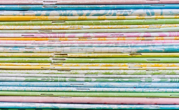 Close-up of old colorful notebook spine with staples, background — Stock Photo, Image