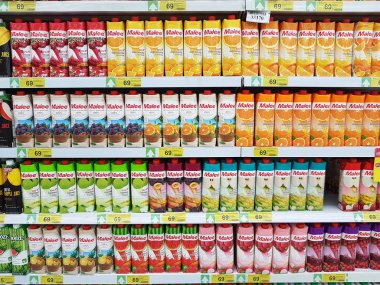 CHIANG RAI, THAILAND - FEBRUARY 15 : various brand of fruit juice in packaging for sale on supermarket stand or shelf on February 15, 2017 in Chiang rai, Thailand. clipart