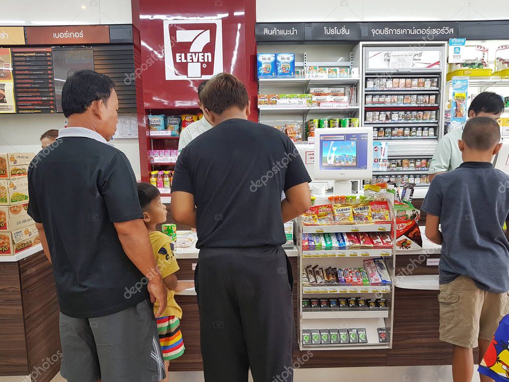 CHIANG RAI, THAILAND - MAY 8 : Unidentified people standing at the cashier counter at a 7-Eleven shop on May 8, 2017 in Chiang rai, Thailand.