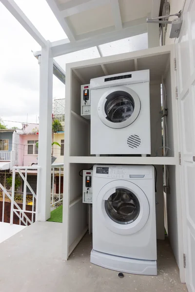 coin laundry machine service in a hostel in Thailand