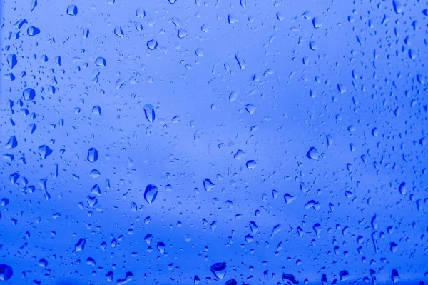 An abstract image of water droplets in the color of the classic blue. — Stock Photo, Image