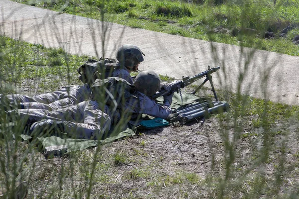 Ground soldiers on the outdoor shooting range
