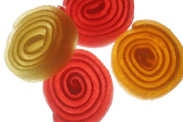 Espirales Amarillas Rojas Azúcar Sobre Fondo Blanco —  Fotos de Stock