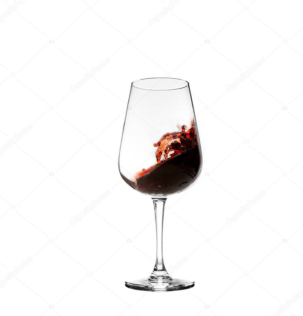 red wine swirl in a transparent glass with white background