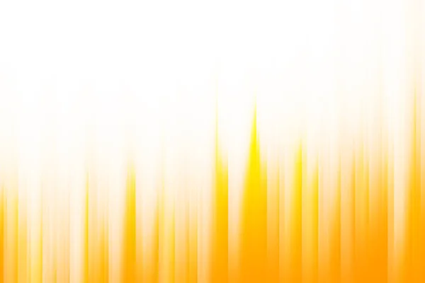 Rays of light orange and yellow blend to create abstract background
