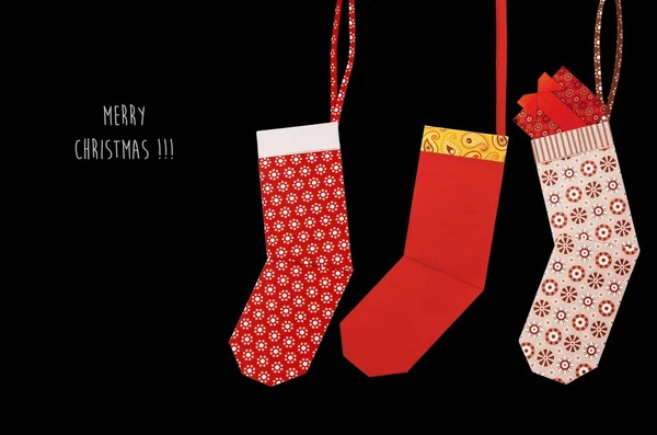 Орігамі червона різдвяна шкарпетка з подарунками — стокове фото