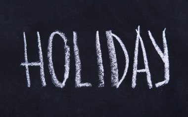 Tahta arkaplanda Tatil Yazısı olan karatahta