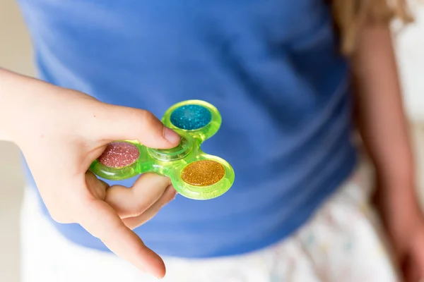 Young Girl Playing with Fidget Hand Spinner — Stock Photo, Image