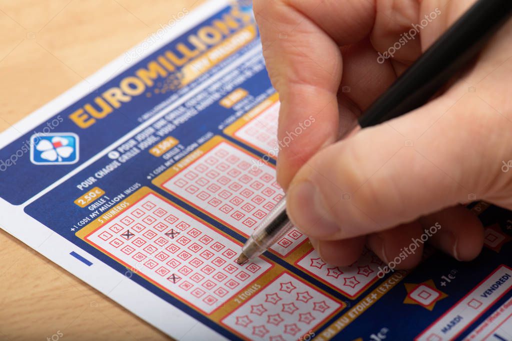 Paris, France -  November 21, 2019 : Closeup of aperson filling a lotto grid , Euromillions,   from the society FDJ  (La francaise des jeux)