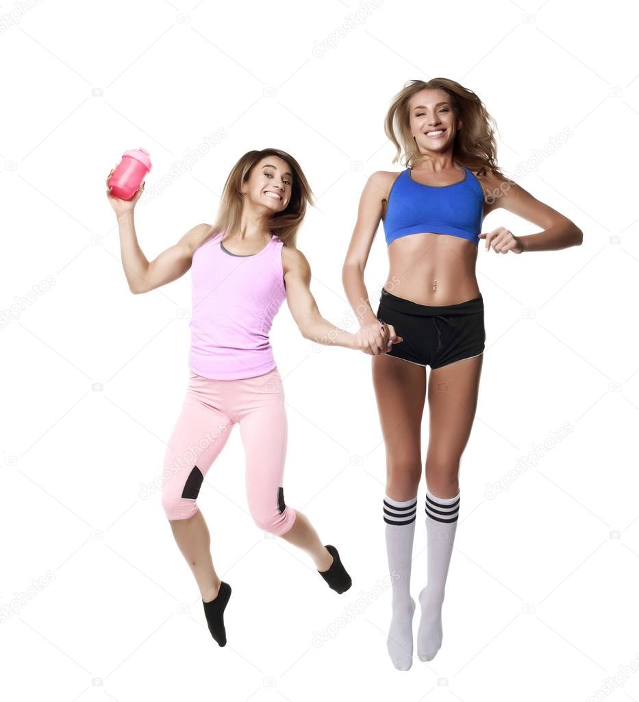 two fitness girl on white baground