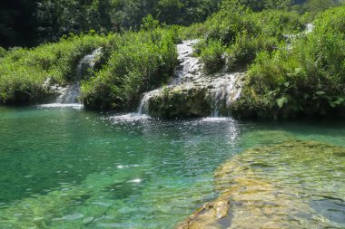 Natural reserve in Guatemala Semuc Champey, one of the natural wonders clipart