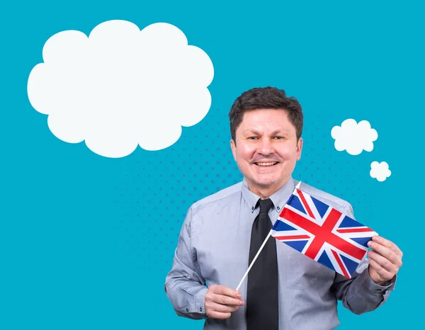 Welcome to Great Britain! Learn English! Adult man with the flag of the Kingdom of Great Britain on a blue background. Banner for advertising English language courses.