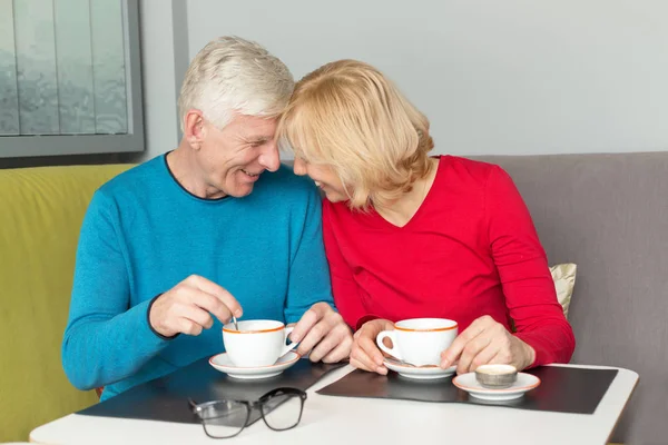 Happy Adult Couple Drinking Coffee While Sitting Table — Stock Photo, Image