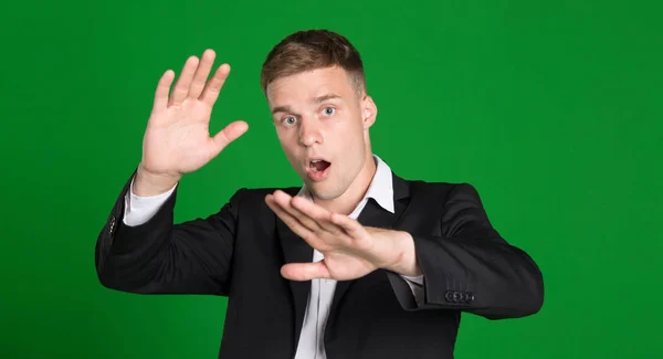 Fright Young Man Protected Hands Fear Isolated Green Background — Stock Photo, Image