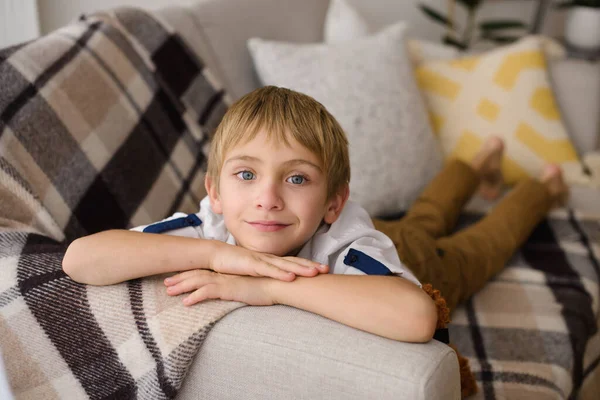 Portrait Beautiful Little Boy Resting Lying His Stomach Sofa Checkered — Stock Photo, Image