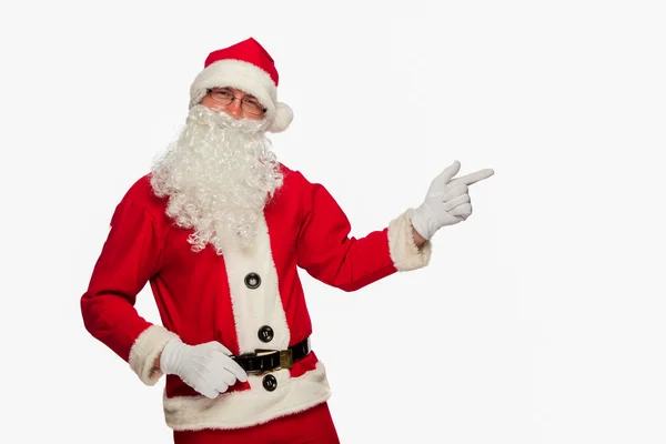 Santa Claus señalando signo con sonrisa, aislado en el fondo blanco —  Fotos de Stock