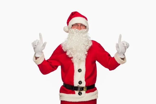Père Noël signe pointant avec sourire, isolé sur fond blanc — Photo