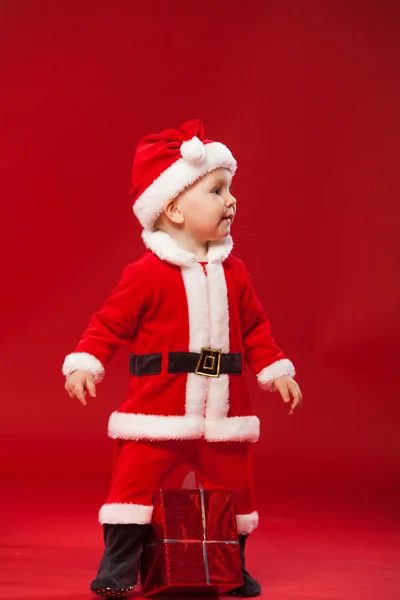 Beautiful little baby celebrates Christmas. New Years holidays. — Stockfoto