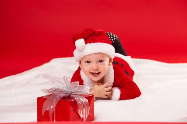 Beautiful little baby celebrates Christmas. New Years holidays. gift — Stock fotografie