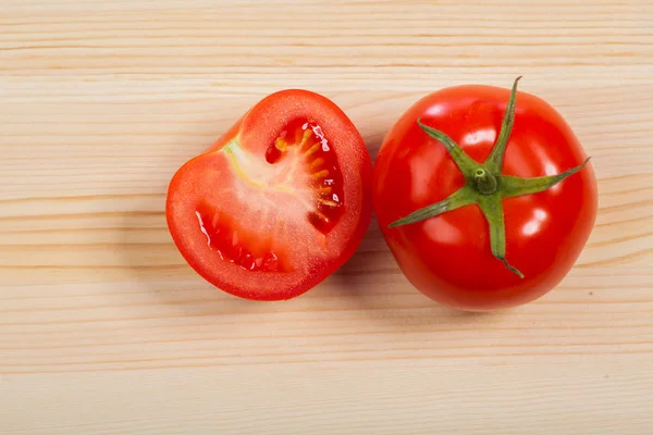 Chopped red tomatoes on the table, isolated — Stock Photo, Image