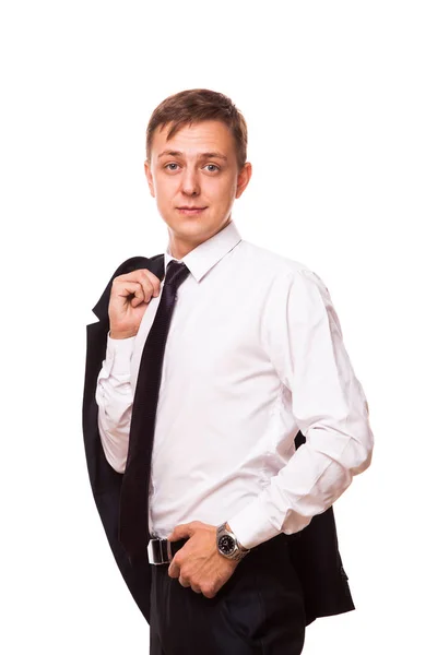 Joven hombre de negocios guapo está sosteniendo una chaqueta en su mano y la otra mano en su bolsillo. retrato aislado sobre fondo blanco — Foto de Stock