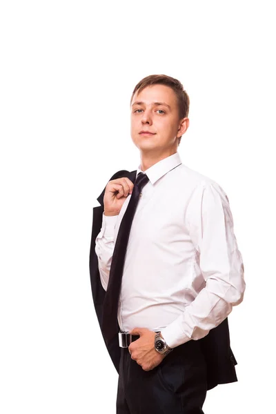 Joven hombre de negocios guapo está sosteniendo una chaqueta en su mano y la otra mano en su bolsillo. retrato aislado sobre fondo blanco — Foto de Stock