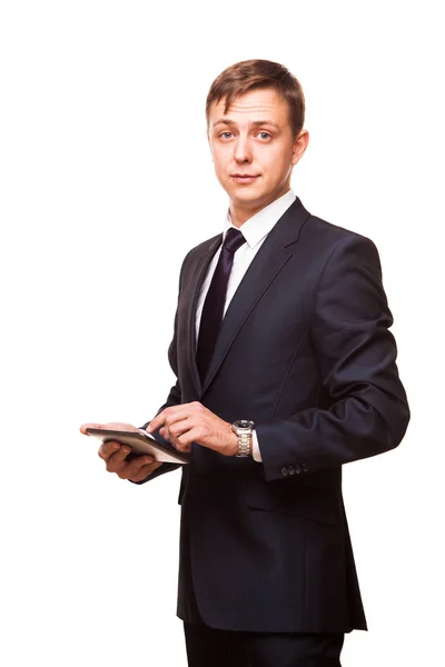 Joven hombre de negocios guapo está trabajando en su tableta digital aislado sobre fondo blanco — Foto de Stock